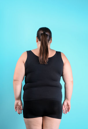 Overweight woman before weight loss on color backgroundの写真素材