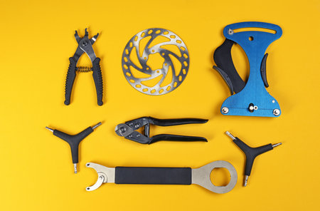 Set of different bicycle tools and part on color background, flat layの写真素材