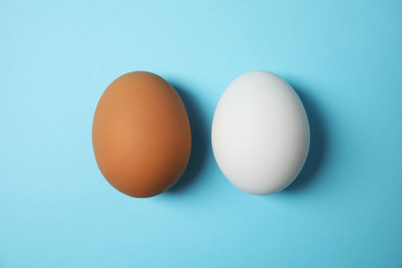 Raw chicken eggs on color background, top viewの写真素材