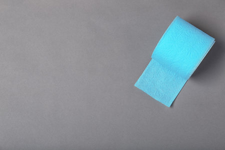 Roll of toilet paper on gray background, top view. Space for textの写真素材