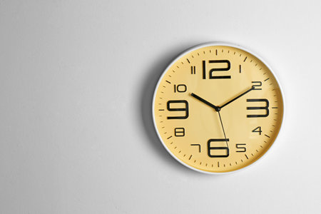 Stylish clock and space for text on light background. time managementの写真素材