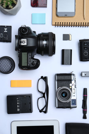 Flat lay composition with equipment for professional photographer on white backgroundの写真素材