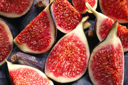 Fresh ripe fig slices as background, top view. tropical fruitsの写真素材
