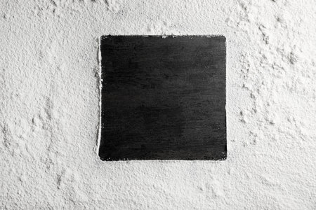 Square frame made of flour on gray background, top view. Space for textの写真素材