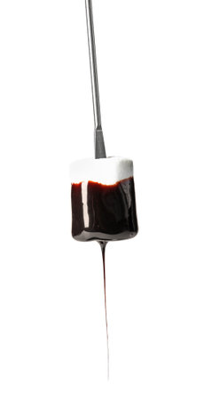 Tasty marshmallow dipped into chocolate fondue on white backgroundの写真素材