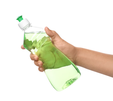 Woman holding bottle of cleaning product for dish washing on white background, closeupの写真素材