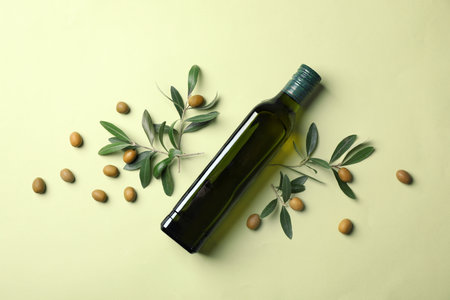 Flat lay composition with bottle of olive oil on color backgroundの写真素材