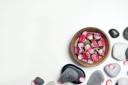 Flat lay composition with spa stones and space for text on white backgroundの写真素材