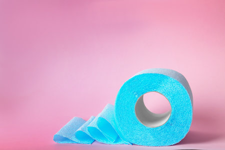 Roll of toilet paper on color background. Space for textの写真素材