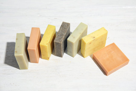 Hand made soap bars on white wooden backgroundの写真素材