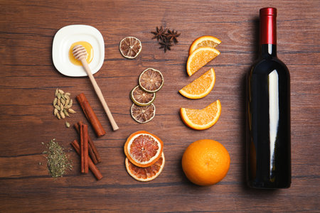 Flat lay composition with ingredients for mulled wine on wooden backgroundの写真素材