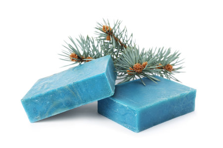Handmade soap bars and fir branches on white backgroundの写真素材