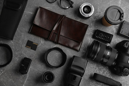 Flat lay composition with photographer's equipment and accessories on gray backgroundの写真素材