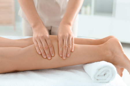 Woman leg receiving massage in wellness center, closeupの写真素材