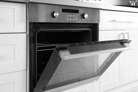 Open modern oven built in kitchen furnitureの写真素材