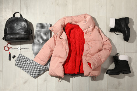 Set of stylish winter outfit on wooden background, flat layの写真素材