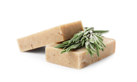 Handmade soap bars and rosemary on white backgroundの写真素材