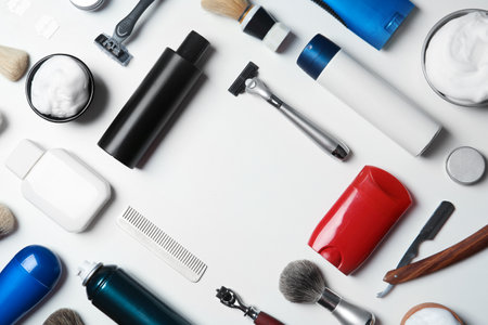 Flat lay composition with men's shaving accessories and space for text on white backgroundの写真素材
