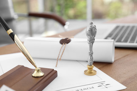 Vintage notary stamp and documents on desk, closeup