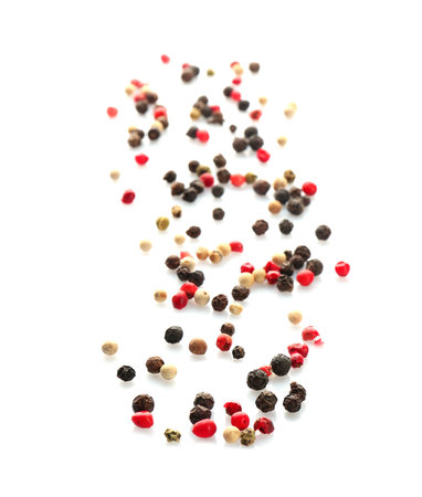 Mix of different pepper grains on white background, top viewの写真素材