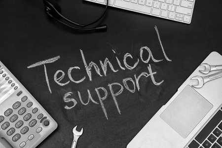 Flat lay composition with words "TECHNICAL SUPPORT" on dark backgroundの写真素材