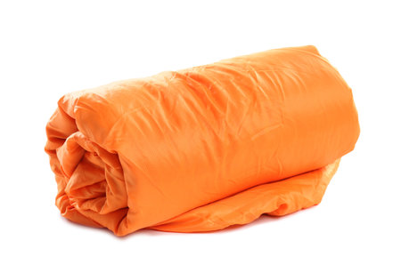 Rolled sleeping bag on white background. camping equipmentの写真素材