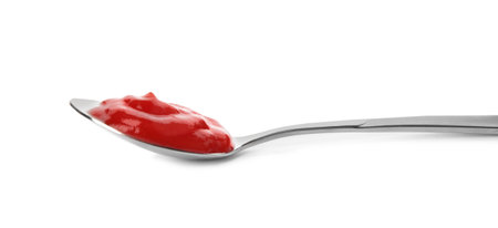 Tasty homemade tomato sauce in spoon on white backgroundの写真素材