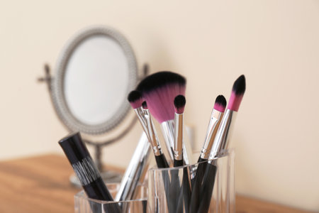 Organizer with cosmetic products for makeup on table against blurred background, closeupの写真素材