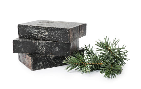 Handmade soap bars and fir branches on white backgroundの写真素材