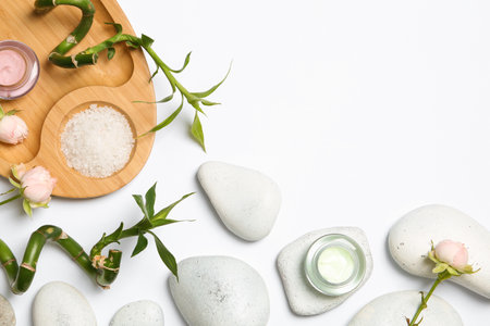 Flat lay composition with spa stones and space for text on white backgroundの写真素材