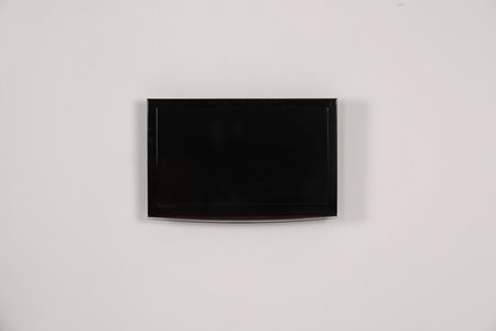 Modern flat screen TV on white background