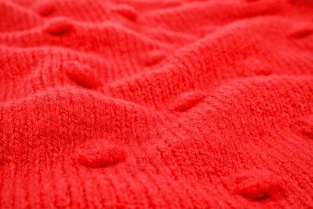 Texture of cozy warm sweater as background, closeup