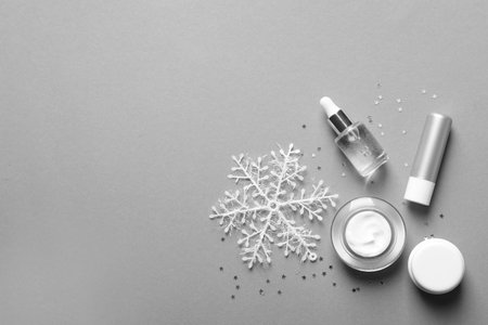 Set of cosmetic products on gray background, flat lay. winter careの写真素材
