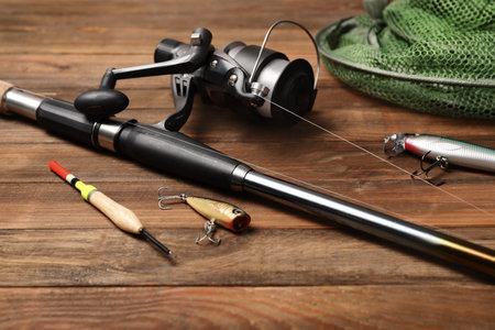 Fishing tackle on wooden table. recreational activity