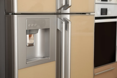 Refrigerator with ice and water system, closeup. modern kitchen appliancesの写真素材