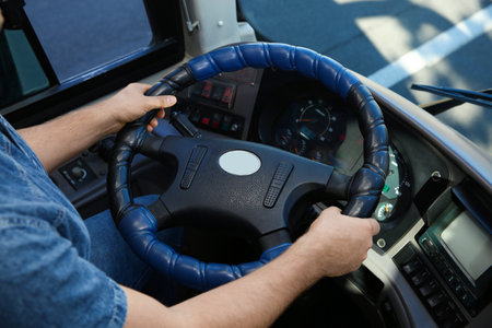 Professional bus driver at steering wheel. Passenger transportationの写真素材