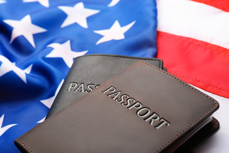 Passports in leather covers on flag of USAの写真素材