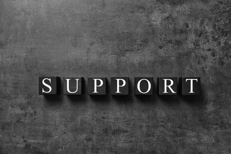 Cubes with word SUPPORT on dark gray background, top view. technical serviceの写真素材