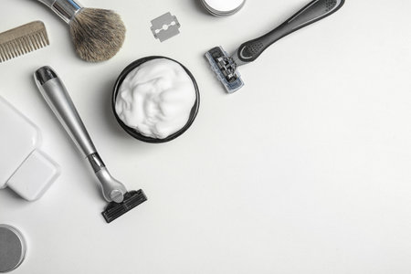 Flat lay composition with men's shaving accessories and space for text on white backgroundの写真素材