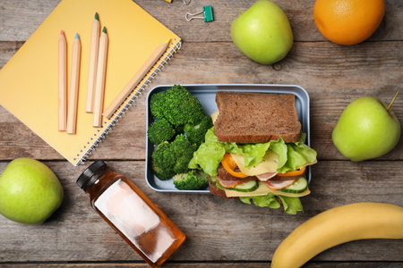 Flat lay composition with healthy food for school child on wooden backgroundの写真素材