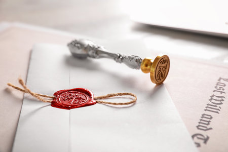 Vintage notary stamp and documents on desk, closeup