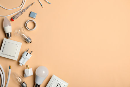Flat lay composition with electrician's tools and space for text on color backgroundの写真素材