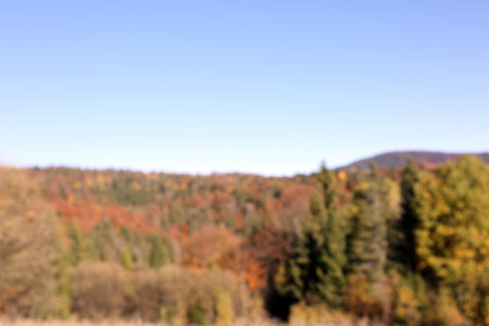 Picturesque landscape with blue sky over mountains, blurred viewの写真素材