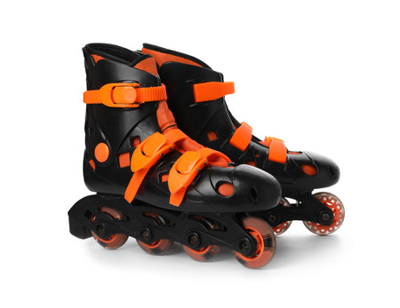 Pair of inline roller skates on white background