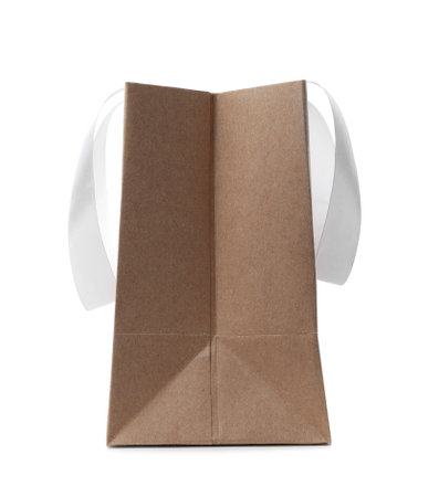 Paper shopping bag with ribbon handles on white backgroundの写真素材