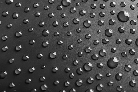 Water drops on black background, top viewの写真素材
