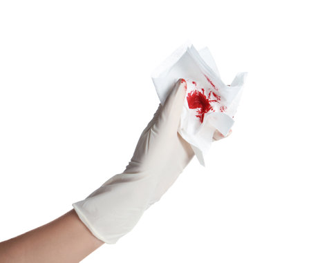 Doctor in medical glove holding tissue with blood on white backgroundの写真素材