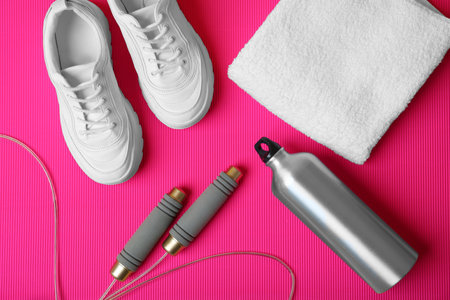 Flat lay composition with fitness equipment on color backgroundの写真素材