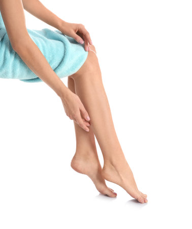 Woman with beautiful legs and feet on white background, closeup. spa treatmentの写真素材