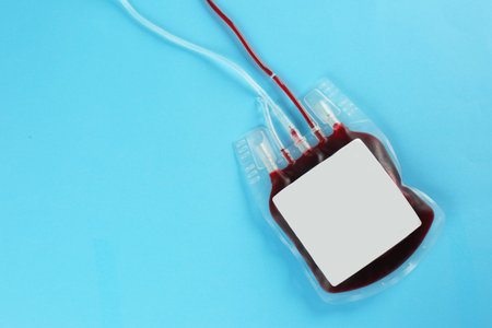 Blood pack on color background, top view with space for text. Donation dayの写真素材